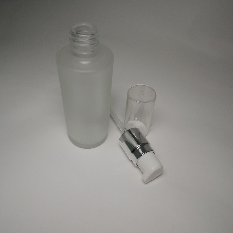 Customization pastel color skincare packaging empty 50ml cylinder shape glass bottle screw neck for cosmetic skincare container