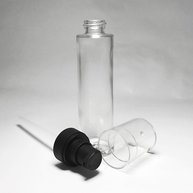 Custom color empty 45ml semi transparent glass bottle cylinder tall shape glass black lotion treatment pump 20/400 screw for skincare lotion