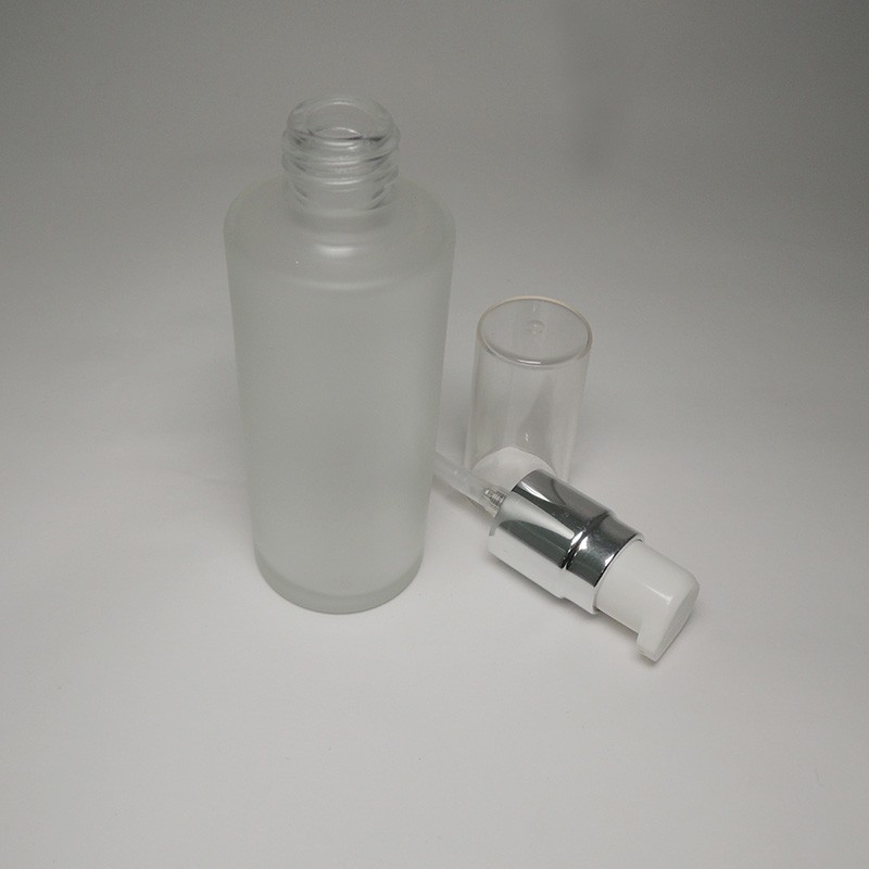 Spray blue color elegance design empty 50ml cylinder glass bottle with silver collar cosmetic lotion pump 18/415 neck size cream pump
