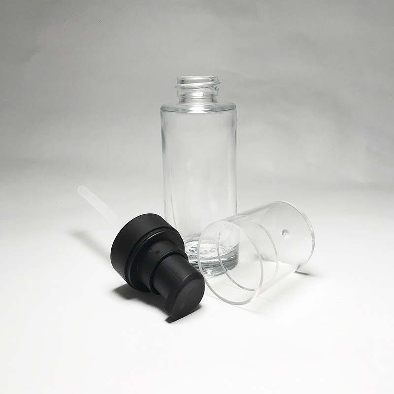 Customized semi transparent pink color empty 35ml cylinder glass bottle for facial skincare lotion pump with transparent cap